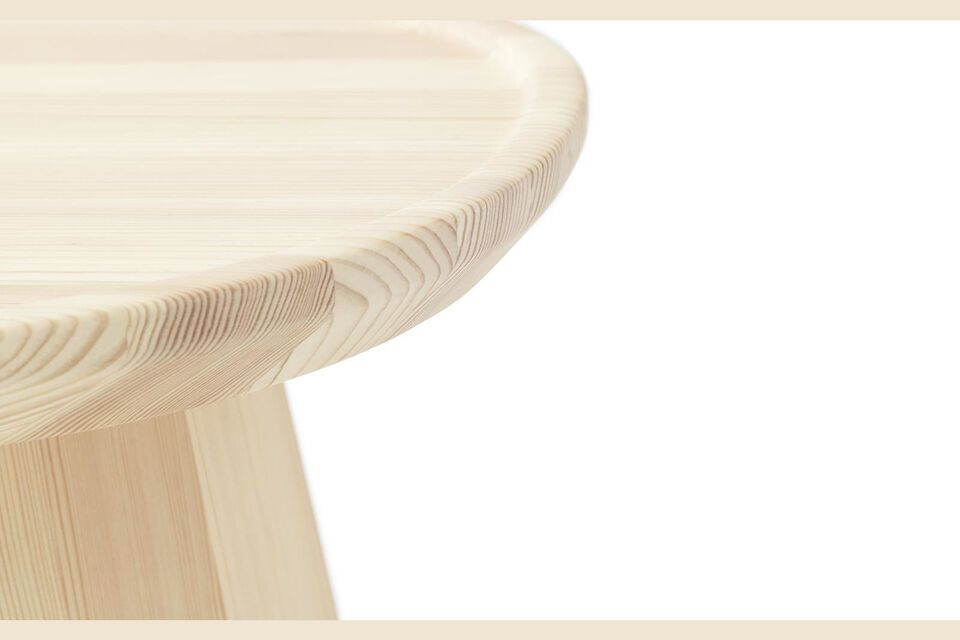 La struttura solida contrasta leggermente con il piano del tavolo sottile e arrotondato